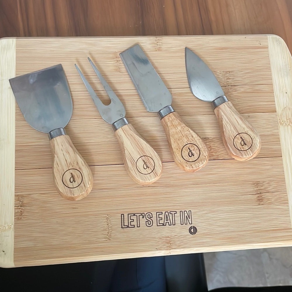 Cheese board with knives